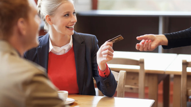 What does it mean if a woman pays the entire bill on a date?
