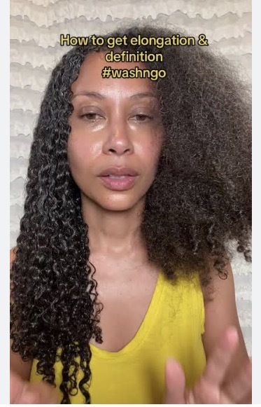 Example of someone with curly hair… half defined curls… half Afro.