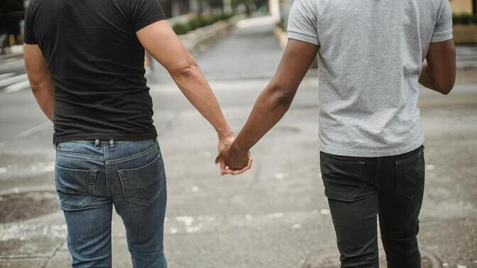 Do you think guys walking hand in hand feminine?