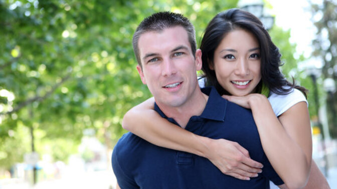 How does culture influence the way people express love, especially when two people come from different cultural backgrounds?