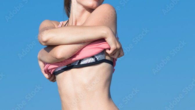 When a woman undresses and says “you don't have to look away,” what does it mean?
