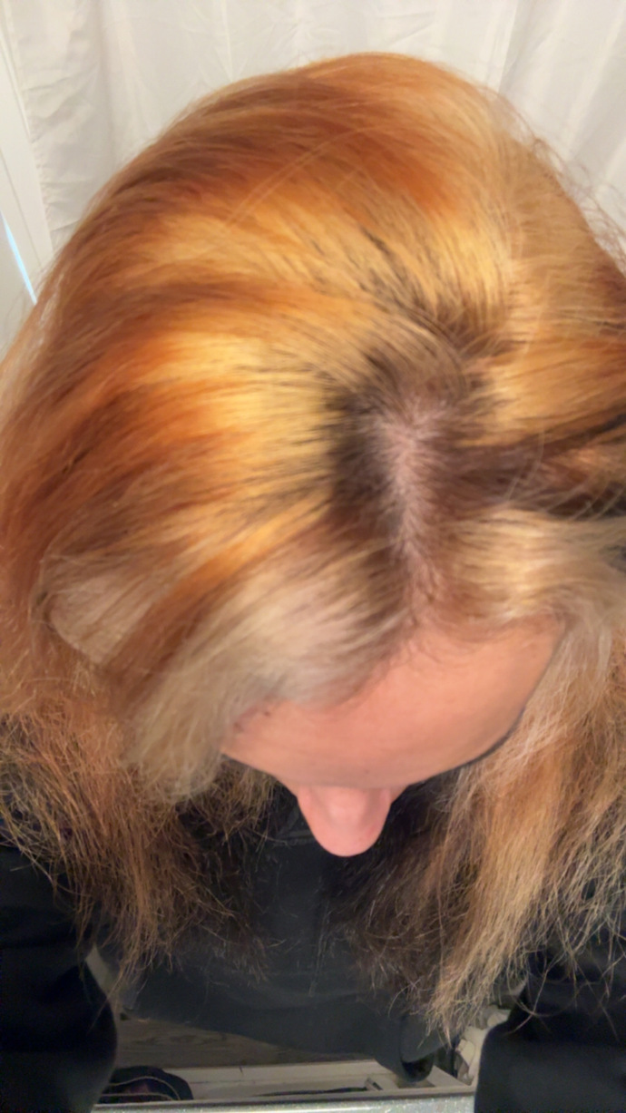 How can I fix my orange roots to a honey golden blonde without re-bleaching?