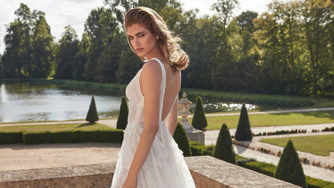 For a garden wedding, should I wear a formal tulle gown or a casual white maxi dress?