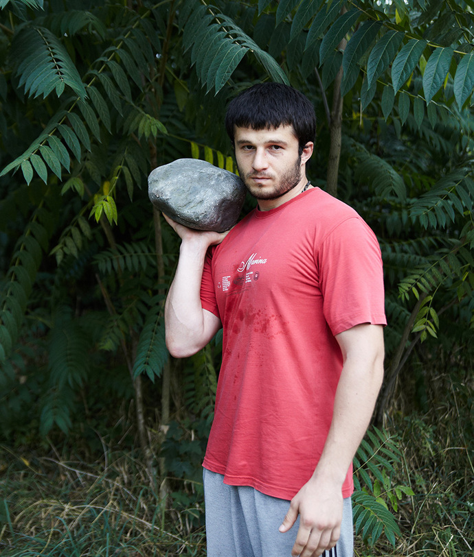 Ossetian man practicing shot put