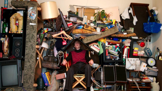 What causes people to become extreme hoarders of useless items?