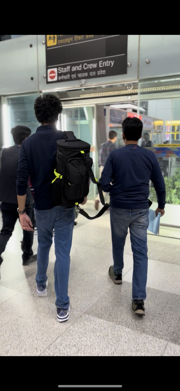 How can I accurately estimate this curly-haired guy’s height from a photo?