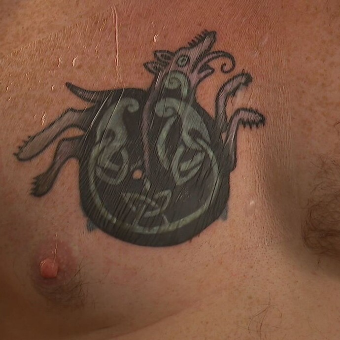 Where exactly is the Nazi tattoo located on his chest?
