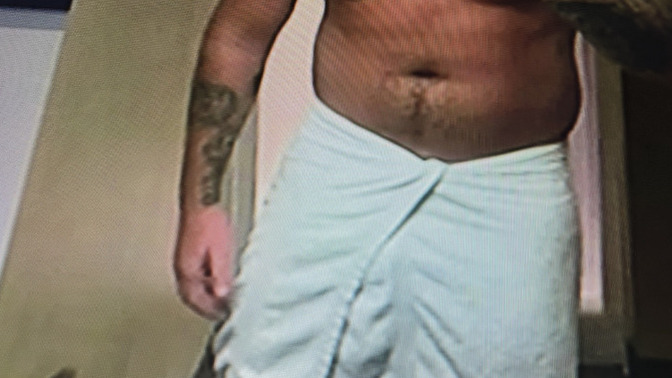 Where exactly is the Nazi tattoo located on his chest?