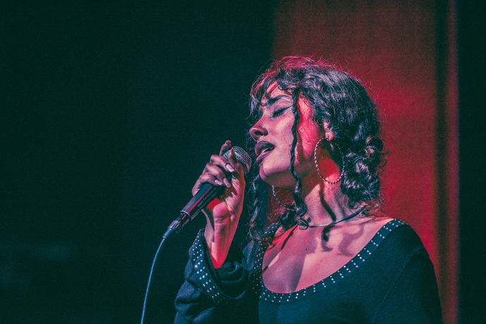 What should a modern artist development program for indie rappers and R&B singers include?