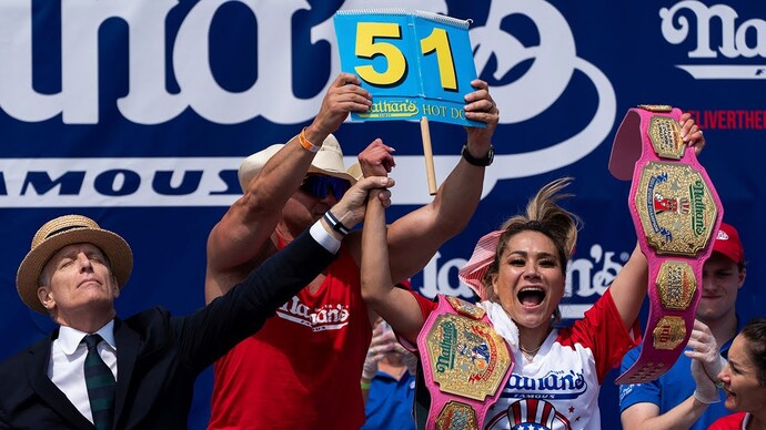 Why are women better at consuming large quantities of hot dogs than men?