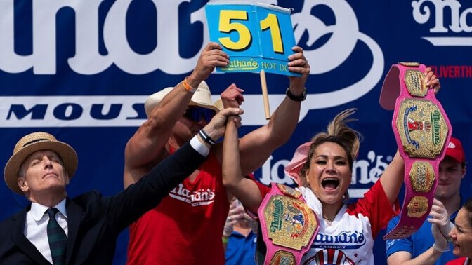 Why are women better at consuming large quantities of "hot dogs" than men?