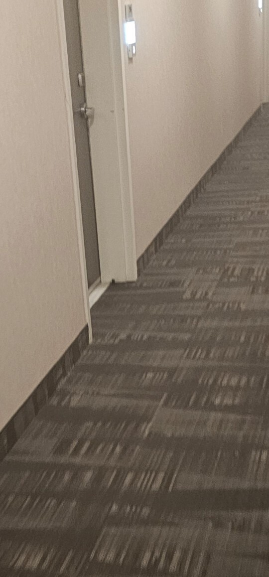 Is this little black device by my neighbor’s door a hidden camera?