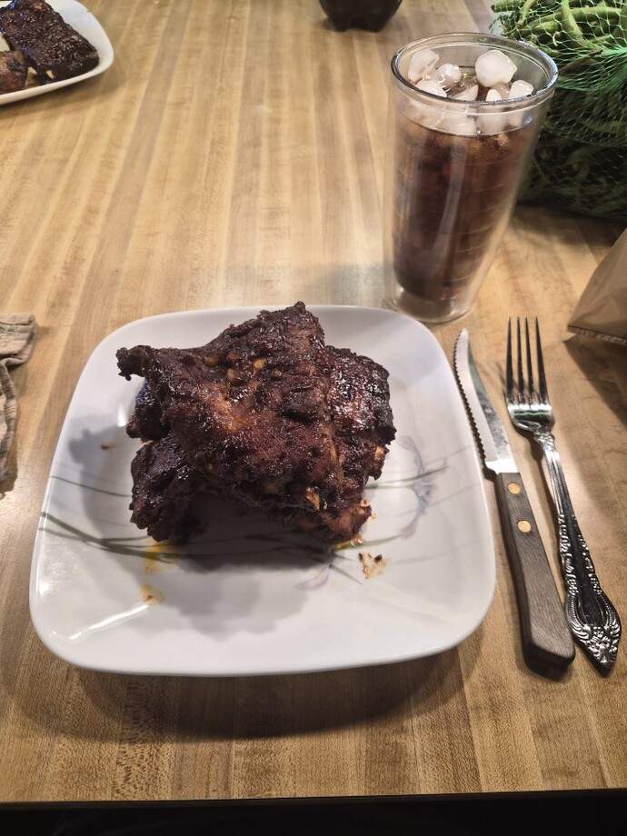 Are BBQ ribs better as an outdoor meal or an indoor meal?