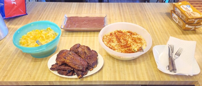 Are BBQ ribs better as an outdoor meal or an indoor meal?