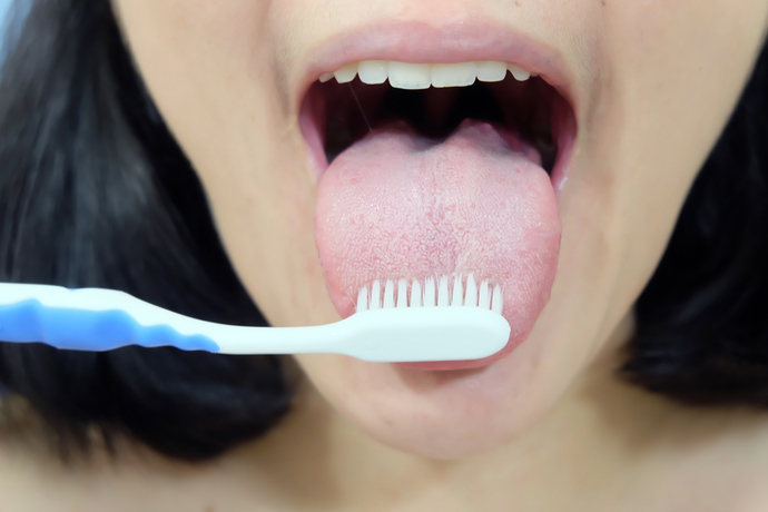 When you brush your teeth, do you also clean or brush your tongue?