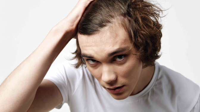 How do I cope with early hair loss and baldness insecurity?
