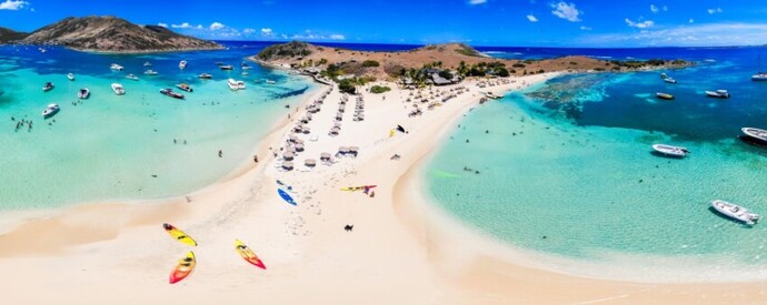 Should I be selfish and drag my aging travel partner to see real St. Barths cultutre, or be considerate and go to Hawaii?