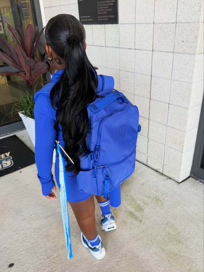 What do you think of this 2nd grader wearing a lace front wig to school?