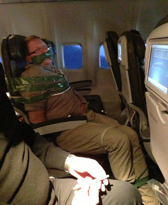 Is duct taping passengers a violation of their free speech rights?