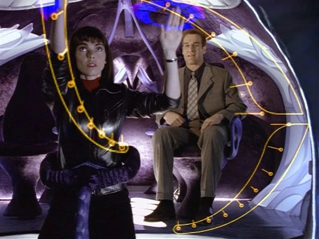 Lili Marquette and William Boone in a Taelon shuttle.