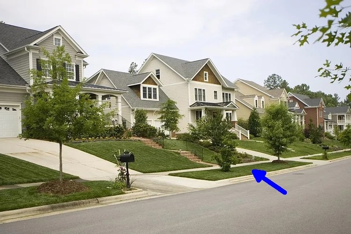 What do you call the grassy strip between the sidewalk and the road?