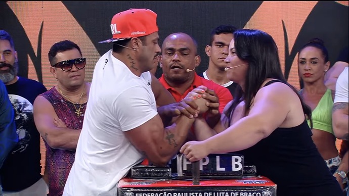 How does this woman manage to beat Bambam at arm wrestling over and over again?