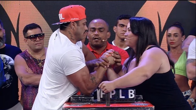 How does this woman manage to beat Bambam at arm wrestling over and over again?