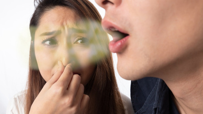 How can I tell my sensitive boyfriend about his bad breath?