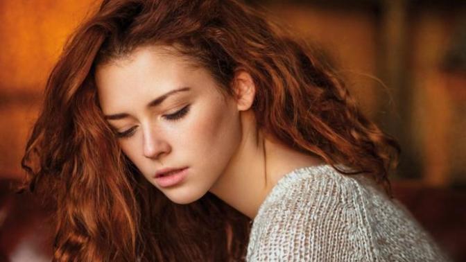 What does it mean when a girl looks down when you look at her?